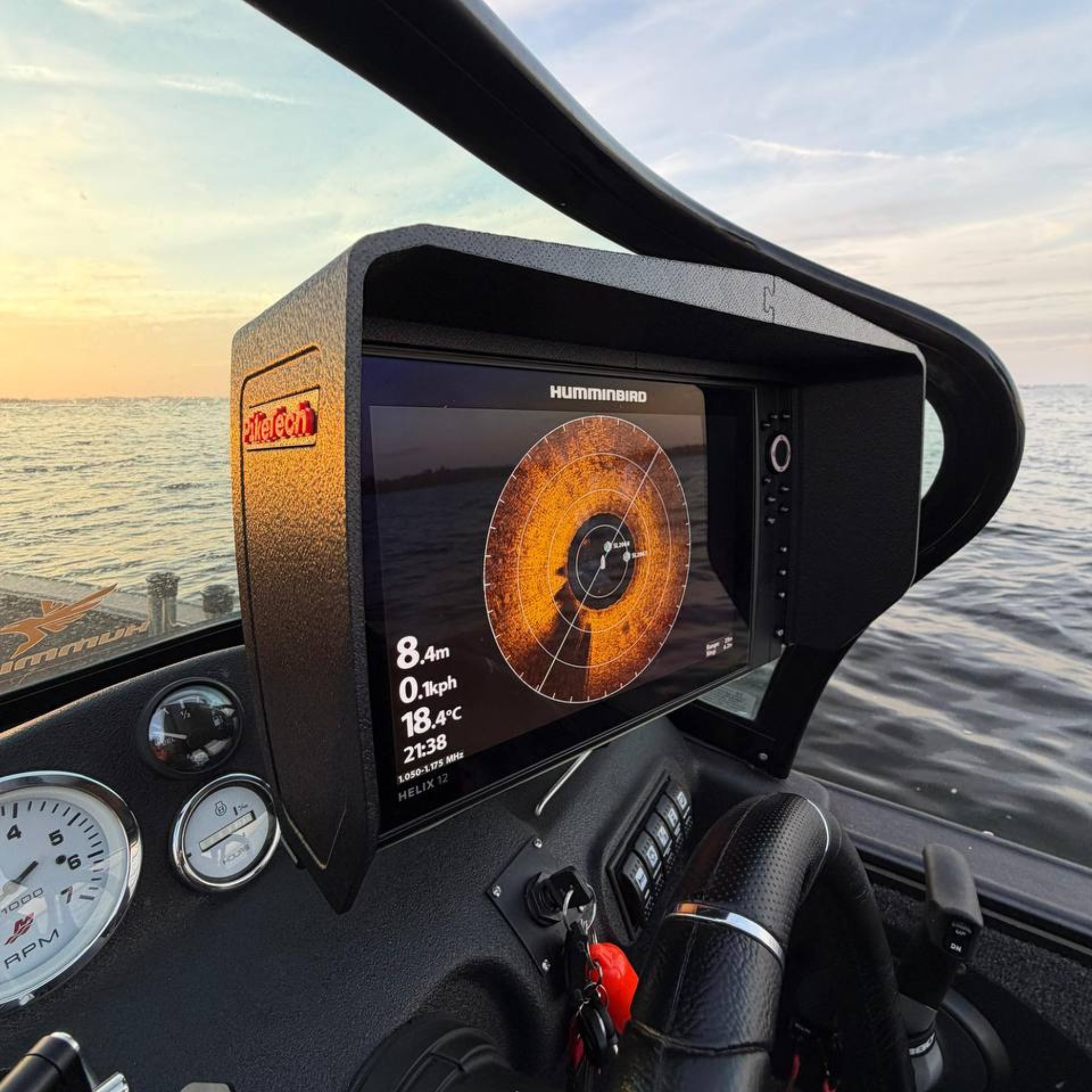 Humminbird HELIX fish finder equipped with PikeTech PRO Visor during a bright day on the water