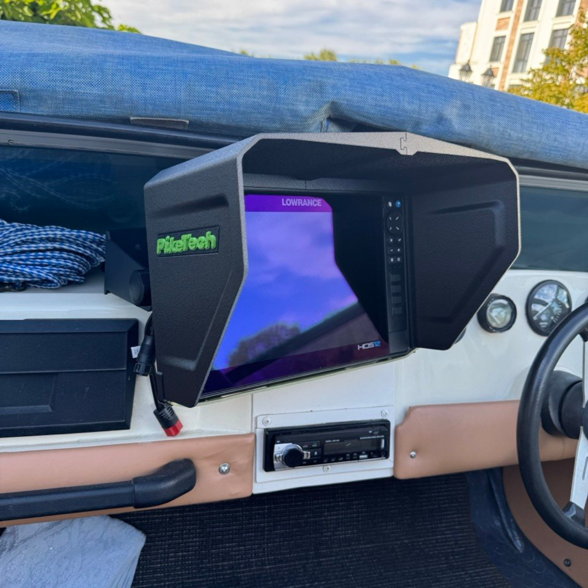 Side angle view showing the protective sun visor design for Lowrance fish finders